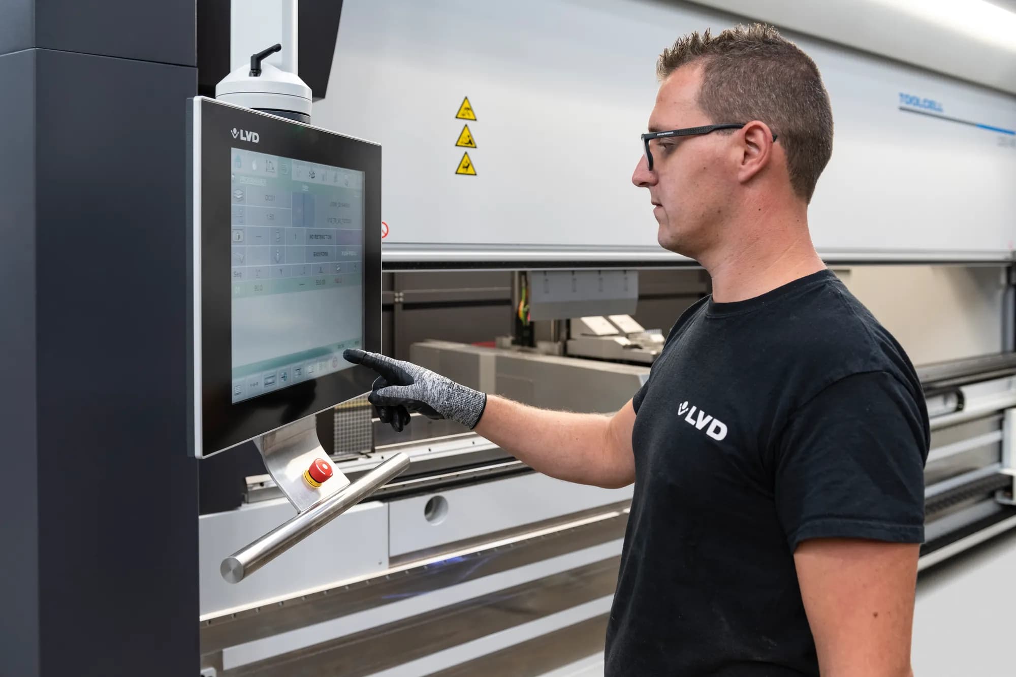 An LVD engineer operating the Touch-B control on a ToolCell press brake