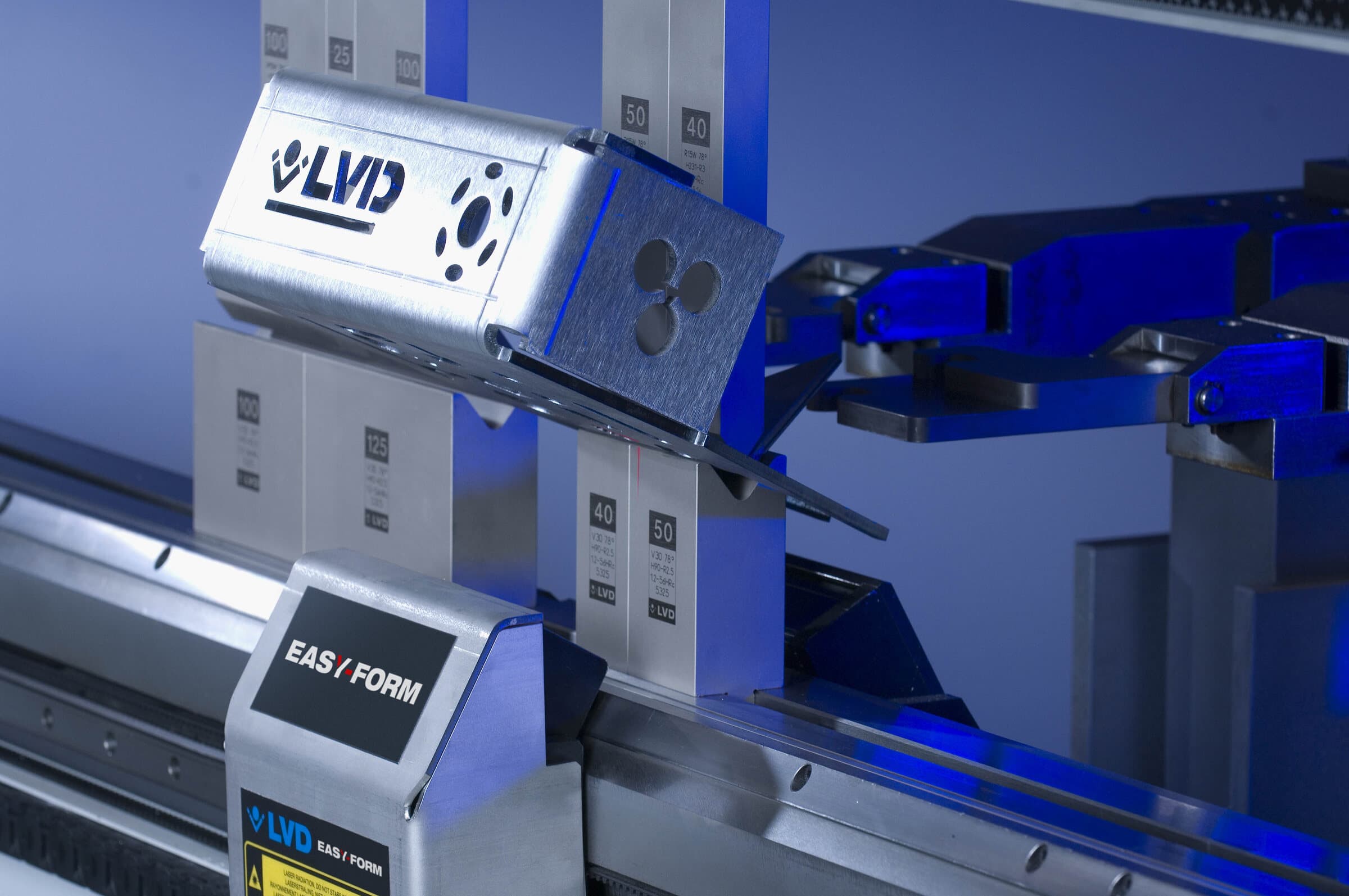 An LVD press brake bending a laser-cut steel component