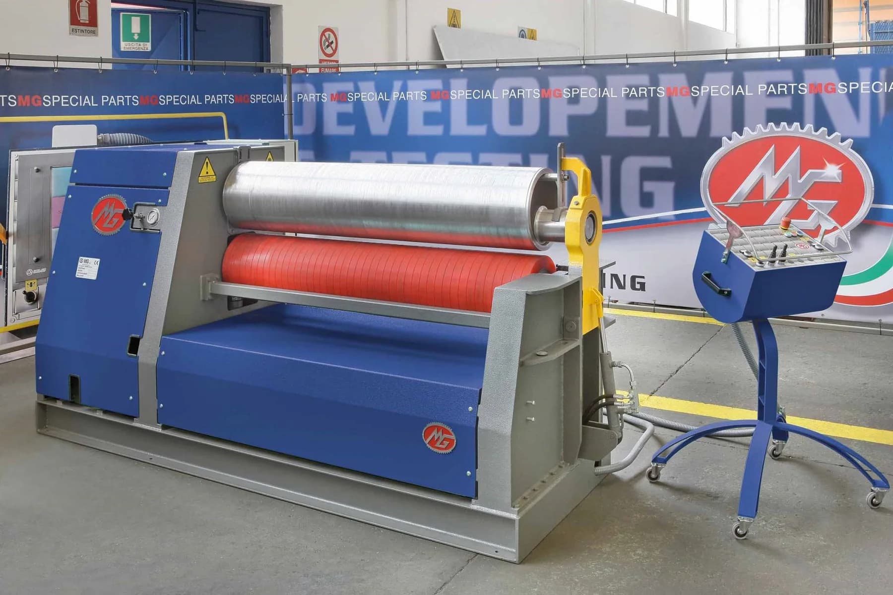 An MG plate bending roll forming a cylinder on the shop floor